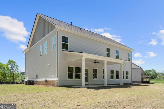 2749 Porches Ln, Dacula, GA 30019 - back of property with a ceiling fan, board and batten siding, a lawn, and central AC unit