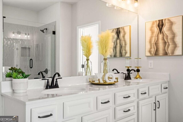 2749 Porches Ln, Dacula, GA 30019 - bathroom featuring a shower stall and double vanity