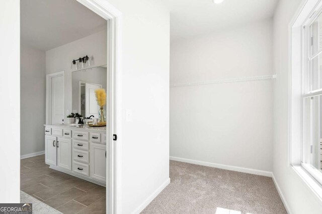 2749 Porches Ln, Dacula, GA 30019 - bathroom with vanity and baseboards