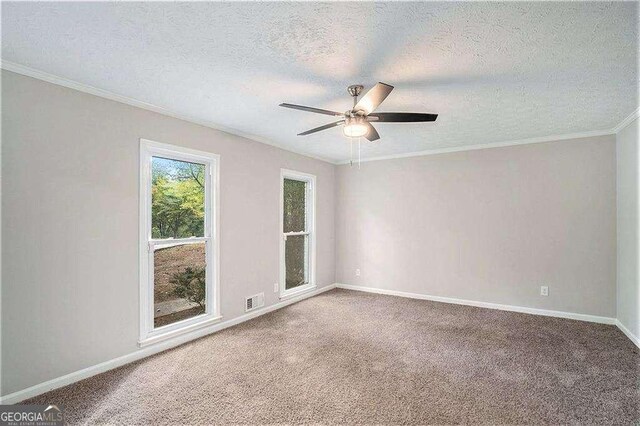3333 Devaughn Dr NE, Marietta, GA 30066 - carpeted spare room featuring a ceiling fan, baseboards, ornamental molding, and a textured ceiling