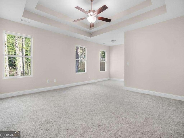 733 Springhill Dr, Gray, GA 31032 - carpeted empty room with a tray ceiling, baseboards, and ceiling fan