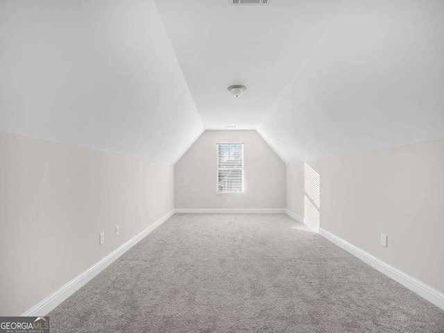 733 Springhill Dr, Gray, GA 31032 - bonus room featuring lofted ceiling, carpet flooring, and baseboards