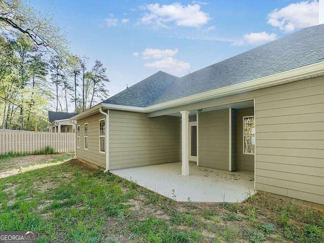 733 Springhill Dr, Gray, GA 31032 - rear view of house featuring fence, a patio, and roof with shingles