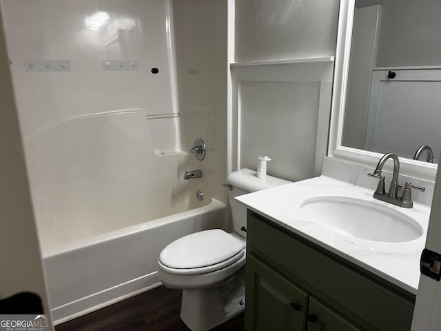 120 Magnolia Trl, Milner, GA 30257 - full bathroom featuring wood finished floors, toilet, vanity, and washtub / shower combination