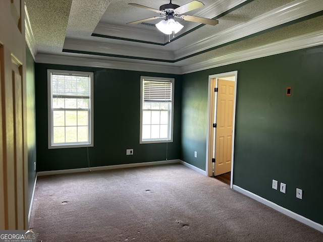 120 Magnolia Trl, Milner, GA 30257 - unfurnished room featuring crown molding, a textured ceiling, a tray ceiling, carpet, and a ceiling fan