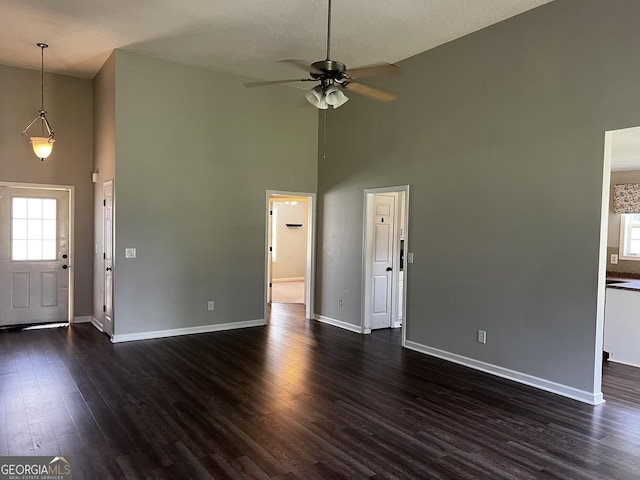 120 Magnolia Trl, Milner, GA 30257 - entryway with high vaulted ceiling, ceiling fan, dark wood finished floors, and baseboards