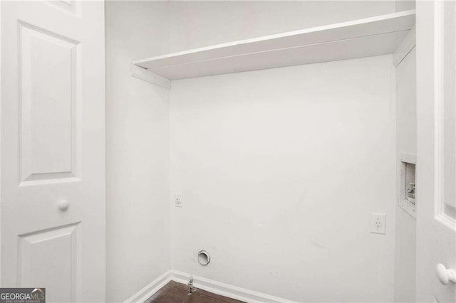 4902 Cedar Ct SE, Conyers, GA 30094 - clothes washing area with baseboards and dark wood-style floors