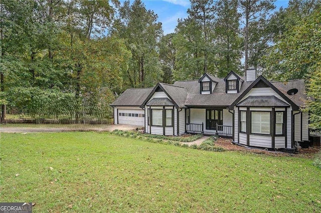 4902 Cedar Ct SE, Conyers, GA 30094 - view of front facade with a front lawn, a chimney, and a garage