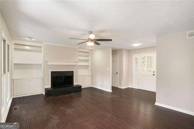 4902 Cedar Ct SE, Conyers, GA 30094 - unfurnished living room featuring ceiling fan, baseboards, wood finished floors, a textured ceiling, and a fireplace