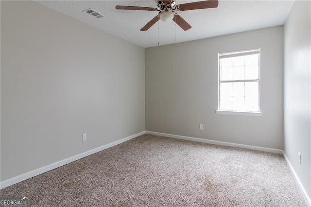 2172 Red Rose Ln, Loganville, GA 30052 - spare room featuring a ceiling fan, carpet, and baseboards