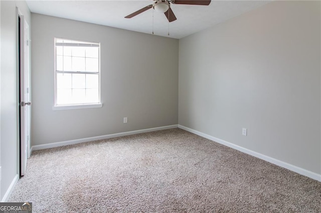 2172 Red Rose Ln, Loganville, GA 30052 - carpeted spare room with ceiling fan and baseboards
