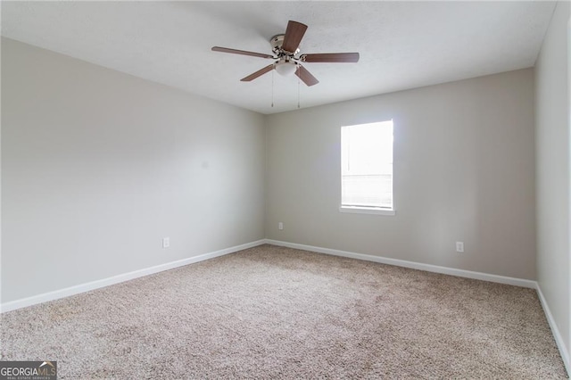 2172 Red Rose Ln, Loganville, GA 30052 - carpeted spare room featuring baseboards and a ceiling fan