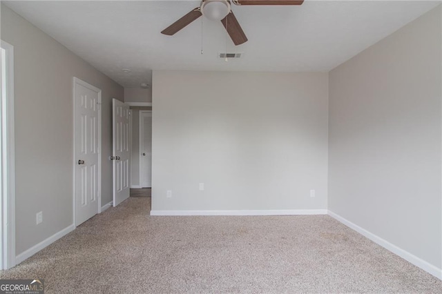 2172 Red Rose Ln, Loganville, GA 30052 - unfurnished room featuring carpet, a ceiling fan, and baseboards