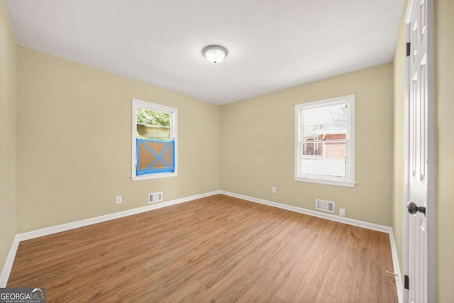 2703 Flagstone Dr SE, Atlanta, GA 30316 - spare room featuring wood finished floors and baseboards