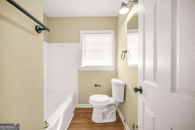 2703 Flagstone Dr SE, Atlanta, GA 30316 - bathroom with a bathtub, plenty of natural light, wood finished floors, and a shower