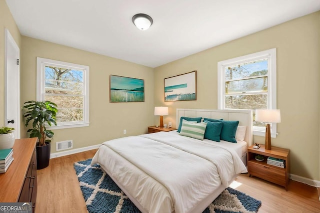 2703 Flagstone Dr SE, Atlanta, GA 30316 - bedroom with light wood-type flooring and baseboards