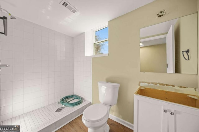 2703 Flagstone Dr SE, Atlanta, GA 30316 - full bathroom with tiled shower, vanity, and wood finished floors