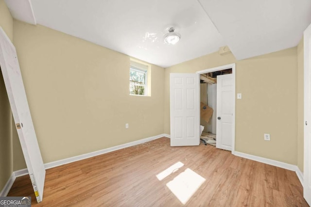 2703 Flagstone Dr SE, Atlanta, GA 30316 - unfurnished bedroom with light wood-style floors and baseboards