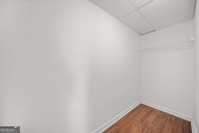 2703 Flagstone Dr SE, Atlanta, GA 30316 - walk in closet featuring a paneled ceiling and wood finished floors