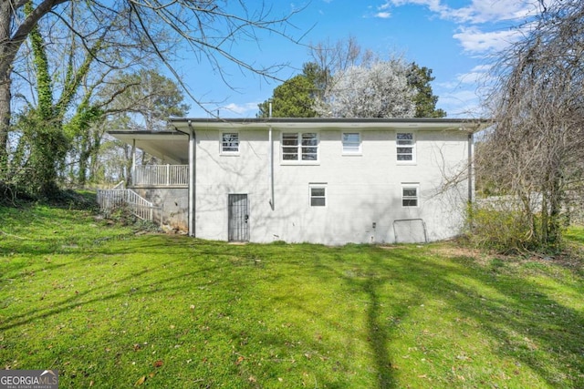 2703 Flagstone Dr SE, Atlanta, GA 30316 - rear view of property with a yard and stairs