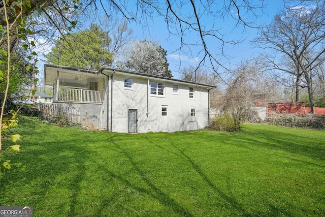 2703 Flagstone Dr SE, Atlanta, GA 30316 - rear view of property featuring a lawn and a balcony