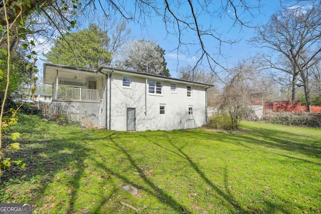 2703 Flagstone Dr SE, Atlanta, GA 30316 - back of house featuring a yard, a balcony, and concrete block siding