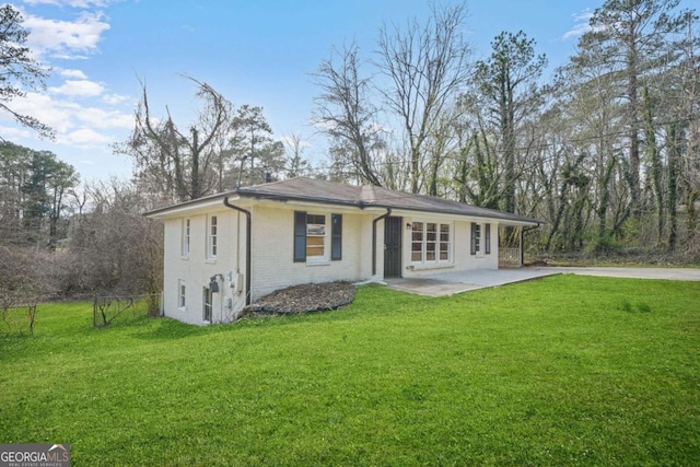 2703 Flagstone Dr SE, Atlanta, GA 30316 - view of front facade with a patio area and brick siding