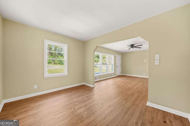 2703 Flagstone Dr SE, Atlanta, GA 30316 - empty room with light wood-type flooring and ceiling fan