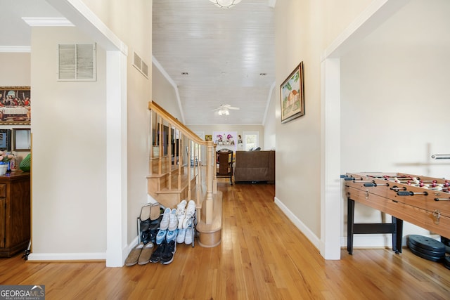 104 Bob White Run, Jackson, GA 30233 - hall featuring stairs, wood finished floors, baseboards, and crown molding