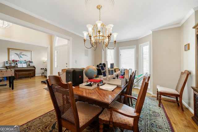 104 Bob White Run, Jackson, GA 30233 - dining room featuring a chandelier, light wood-type flooring, crown molding, and baseboards