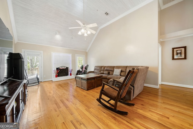 104 Bob White Run, Jackson, GA 30233 - living room featuring light wood-type flooring, baseboards, high vaulted ceiling, a ceiling fan, and ornamental molding