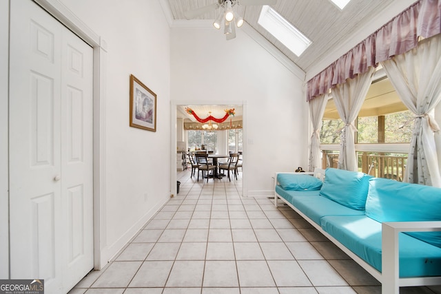 104 Bob White Run, Jackson, GA 30233 - sitting room featuring a skylight, high vaulted ceiling, baseboards, light tile patterned floors, and a ceiling fan