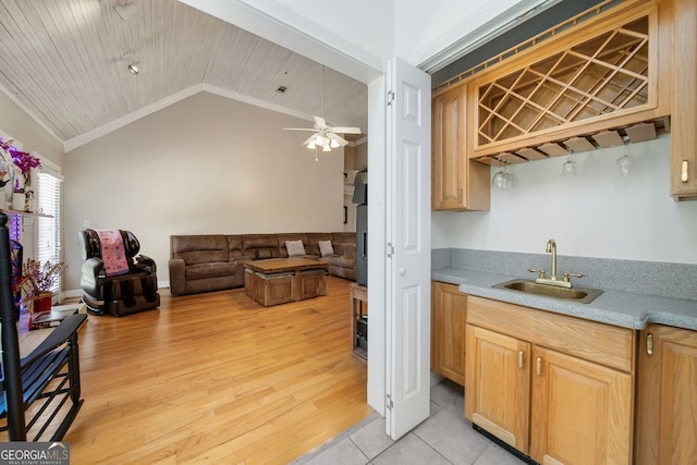 104 Bob White Run, Jackson, GA 30233 - kitchen with crown molding, a sink, lofted ceiling, open floor plan, and light countertops