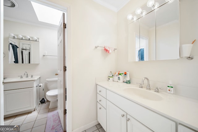 104 Bob White Run, Jackson, GA 30233 - full bathroom with ornamental molding, toilet, two vanities, tile patterned floors, and a skylight