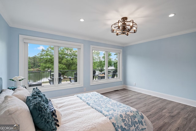 bedroom with a chandelier, wood finished floors, baseboards, crown molding, and recessed lighting