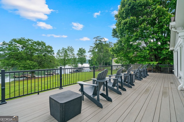 wooden deck with a lawn
