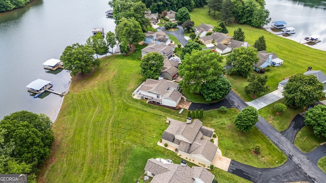 aerial overview of property's location featuring a nearby body of water and nearby suburban area