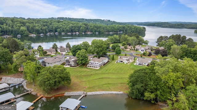 aerial view of residential area featuring a nearby body of water