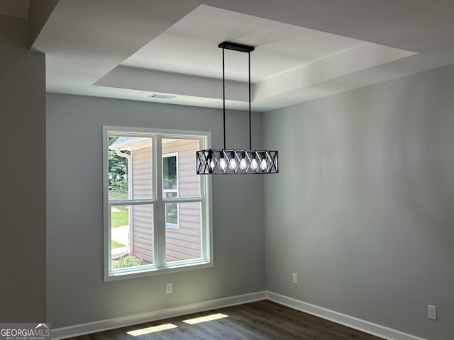 164 David Elder Rd, Griffin, GA 30223 - unfurnished dining area featuring a raised ceiling, dark wood-style floors, and baseboards