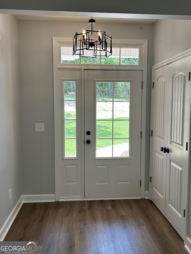 164 David Elder Rd, Griffin, GA 30223 - doorway with a chandelier and dark wood-style floors
