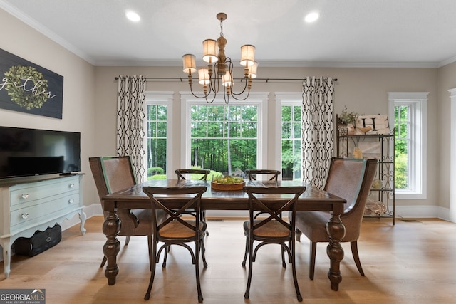 130 Allie Dr, Mcdonough, GA 30252 - dining area with light wood-style flooring, plenty of natural light, crown molding, a chandelier, and recessed lighting