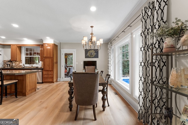 130 Allie Dr, Mcdonough, GA 30252 - dining room with a chandelier, light wood-style flooring, recessed lighting, and baseboards