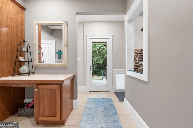 130 Allie Dr, Mcdonough, GA 30252 - doorway to outside featuring light tile patterned flooring and baseboards