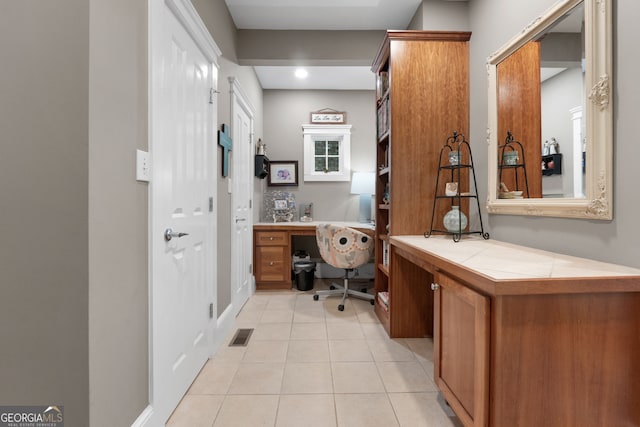 130 Allie Dr, Mcdonough, GA 30252 - office featuring built in desk, light tile patterned flooring, and recessed lighting