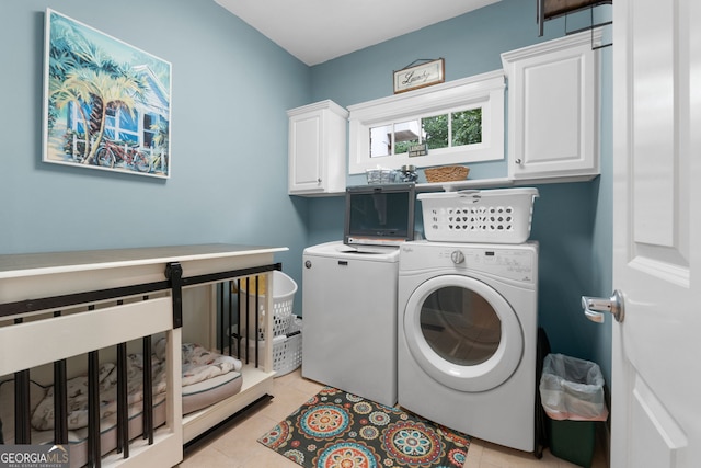 130 Allie Dr, Mcdonough, GA 30252 - laundry room with washing machine and clothes dryer, cabinet space, and light tile patterned floors