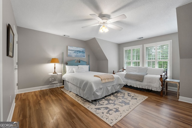 130 Allie Dr, Mcdonough, GA 30252 - bedroom with baseboards, wood finished floors, a textured ceiling, and a ceiling fan