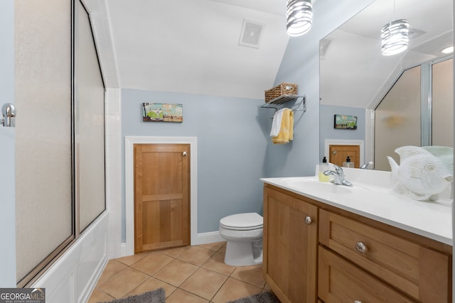 130 Allie Dr, Mcdonough, GA 30252 - bathroom with lofted ceiling, vanity, toilet, tile patterned floors, and shower / bath combination with glass door