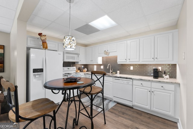 130 Allie Dr, Mcdonough, GA 30252 - kitchen featuring white appliances, white cabinetry, tasteful backsplash, and a drop ceiling