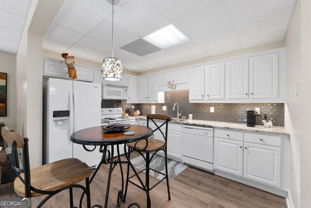130 Allie Dr, Mcdonough, GA 30252 - kitchen featuring white appliances, white cabinetry, tasteful backsplash, and a drop ceiling