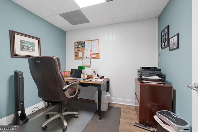 130 Allie Dr, Mcdonough, GA 30252 - office area featuring wood finished floors, a paneled ceiling, and baseboards